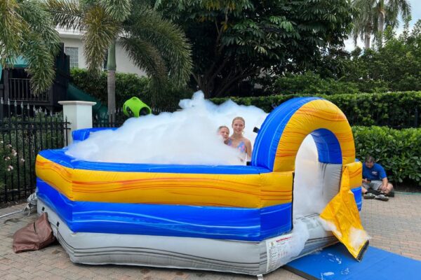 Guest enjoying foam party rental with child