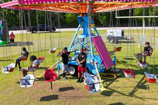 Cyclone Swing with Ride Operators standing in front